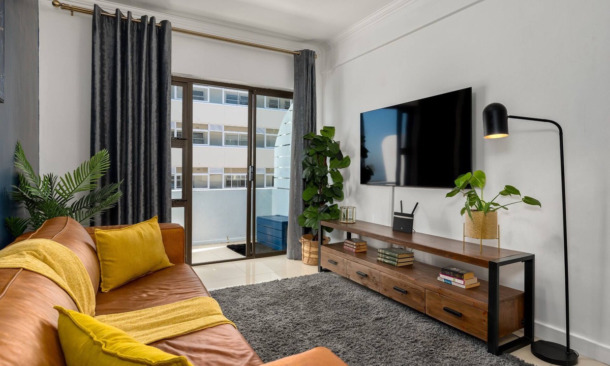Mouille Point Apartment | Chic Beachfront Oasis - Balcony - Netflix