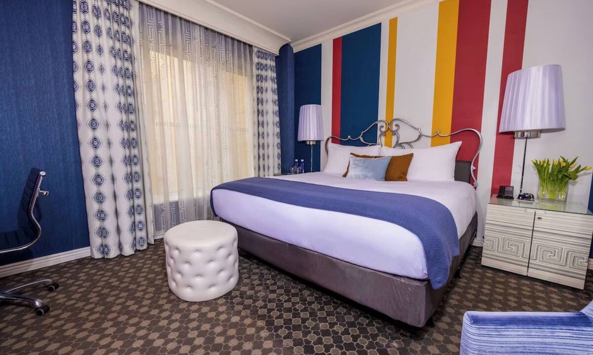Theater District Hotel | Enjoy Romantic Getaway at French-Style Room w/Cozy Ambience & Central Location