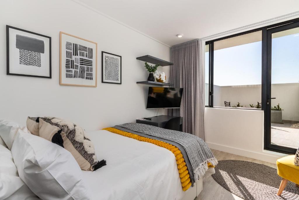 Cape Town City Centre Apartment | One On Albert -Vibrant Woodstock Apartment with Private Patio Area