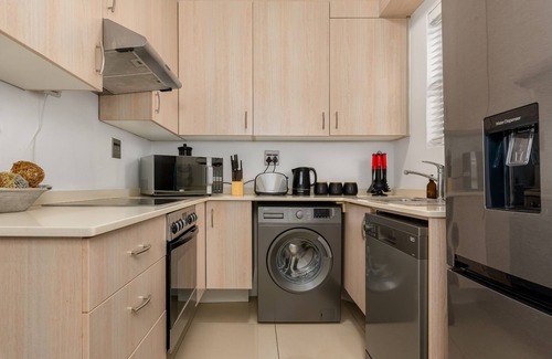 Mouille Point Apartment | Chic Beachfront Oasis - Balcony - Netflix