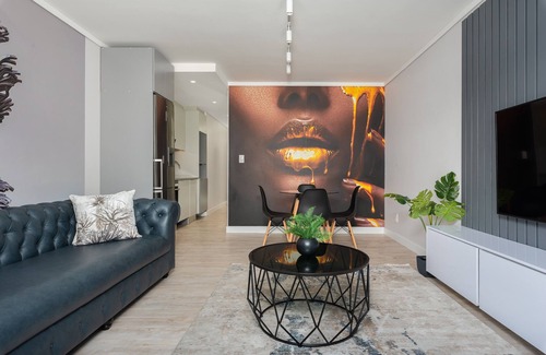 Milnerton Apartment | Elegant Seaside Village Apartment with Garden View