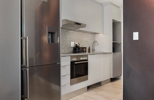 Milnerton Apartment | Elegant Seaside Village Apartment with Garden View
