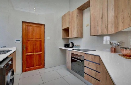 Greater Johannesburg Metropolitan Area House | Modern & Spacious 4 Bed, Home in Heart of Sandton!
