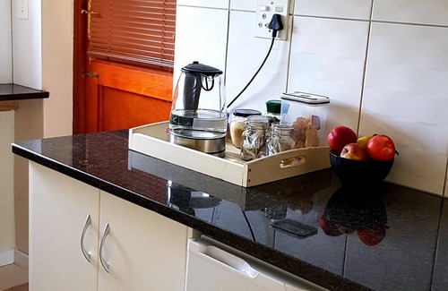 Somerset West House | Neat, modern, comfy and secure apartment with a leafy garden and parking.