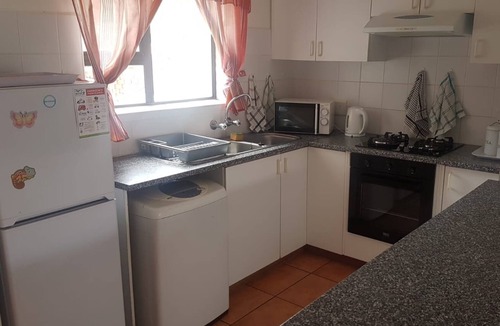 Hartenbos House | A comfortable livingroom, fully equipped kitchen make you feel at home apartment