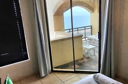 Umhlali Apartment | Bali Hai Beach and Sea Views. Beachfront infinity pool overlooking the ocean.