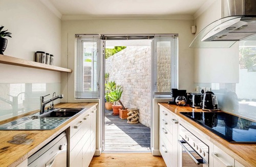 Camps Bay Apartment | Beachy Apartment w Pool and Ocean Views Beach Steps