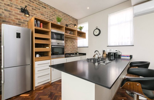 Downtown Johannesburg Apartment | Brand New, City Center Penthouse with Rooftop Hot Tub and Giant Chess Set