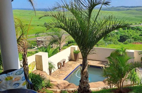 Kingsburgh House | Cozy one bedroom suite, with a balcony, overlooking the pool and braai area.