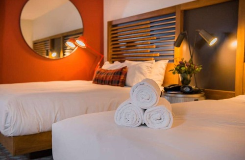 Live Oak Hotel | Cozy Sanctuary: Fireside, Pool, and Nature Trails for Your Discovery