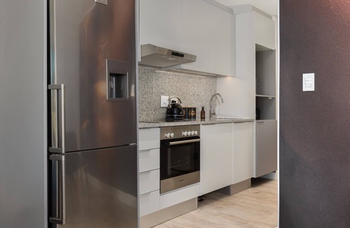 Milnerton Apartment | Elegant Seaside Village Apartment with Garden View