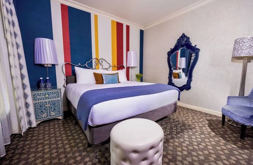 Theater District Hotel | Enjoy Romantic Getaway at French-Style Room w/Cozy Ambience & Central Location