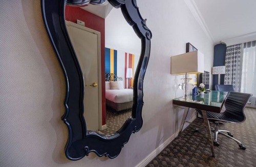 Theater District Hotel | Enjoy Romantic Getaway at French-Style Room w/Cozy Ambience & Central Location