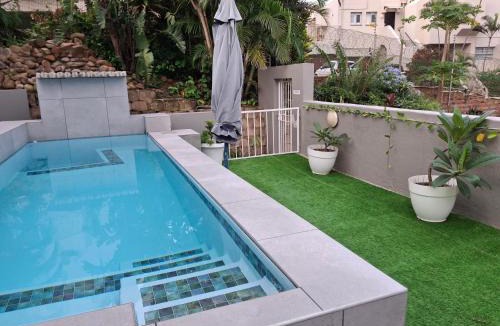 Umhlanga House | Garden Facing Upstairs En-Suite Bedroom In Main House