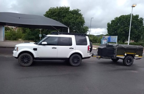 Hilton House | Land Rover Discovery, roof top tent and off road trailer with driver