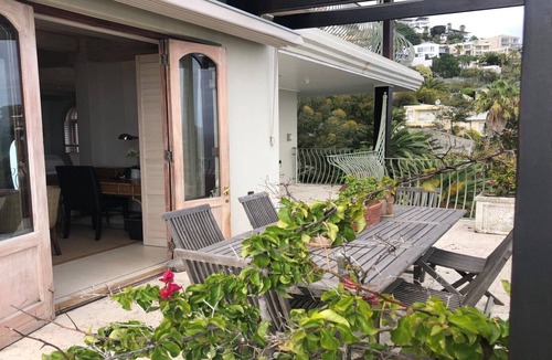 Bantry Bay Villa | Luxurious en-suite bedroom with lounge stunning sea view & balcony in Bantry Bay