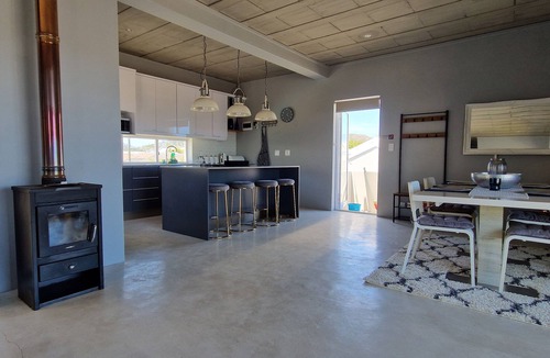 Sandbaai House | Luxury 2 Bed apartment boasting a rooftop terrace, with mountain & sea views.