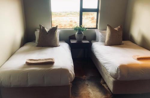Dr Ruth Segomotsi Mompati District Municipality Cabin | Morakane Safari Lodge