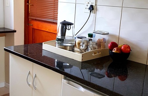 Somerset West House | Neat, modern, comfy and secure apartment with a leafy garden and parking.