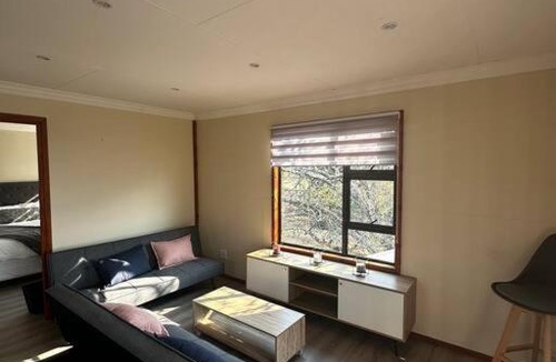 Lanseria Apartment | Quaint Log Cabin