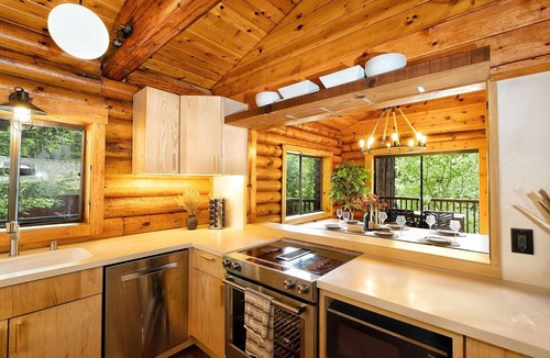 Northwood Cabin | Riverfront cabin, hot tub, private dock, redwoods, ping-pong, foosball