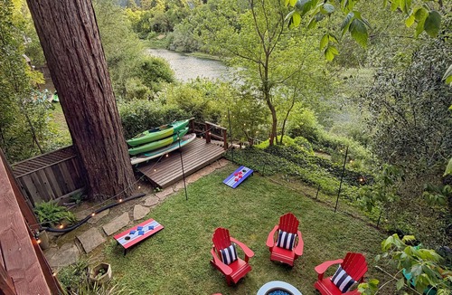 Northwood Cabin | Riverfront cabin, hot tub, private dock, redwoods, ping-pong, foosball