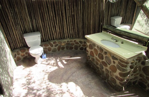 Thorny Bush Game Reserve House | Romantic canvas pad on river, share shower with monkeys and listen to the lions