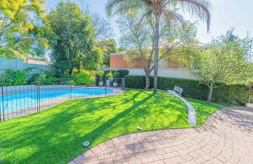 Greater Johannesburg Metropolitan Area House | Spacious Manor with Cozy Fireplace, Garden & Pool