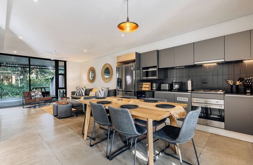Salt Rock Apartment | Stylish Retreat, Forest, Braai & Back-up Power