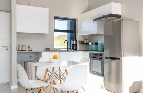 Mykonos Apartment | Stylish Urban Stay | Balcony | Lagoon View