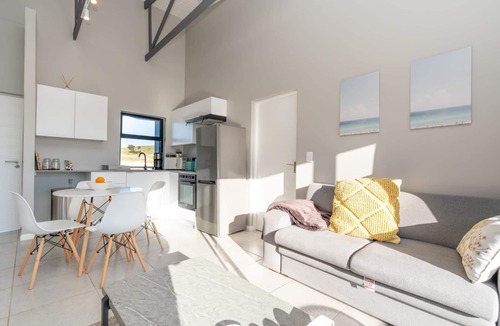 Mykonos Apartment | Stylish Urban Stay | Balcony | Lagoon View