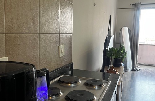 Downtown Johannesburg Apartment | Urban energy meets secure comfort in a historic landmark.