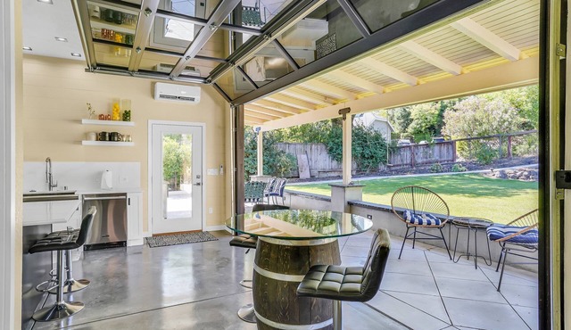 Dramatic and Unique Industrial Door Blurs The Boundaries Between Inside and Out