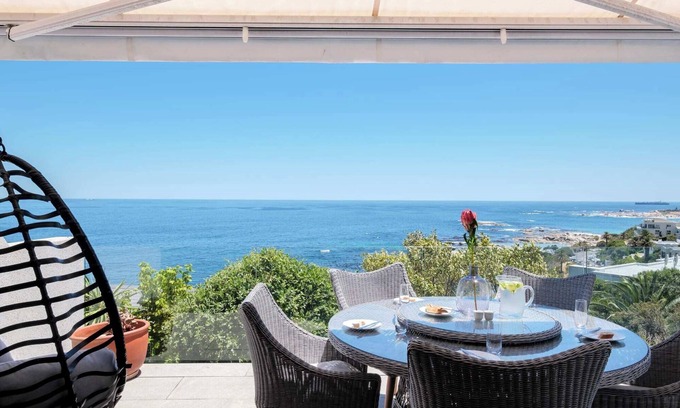 Camps Bay Apartment | Beachy Apartment w Pool and Ocean Views Beach Steps