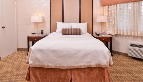 Suite, 1 Queen Bed, Refrigerator & Microwave, Courtyard Area (Living Room)